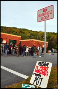 Activists cross an arbitrary line on the pavement to show support for and wait for the release of Rich Paul. (Photo by James Schmill)